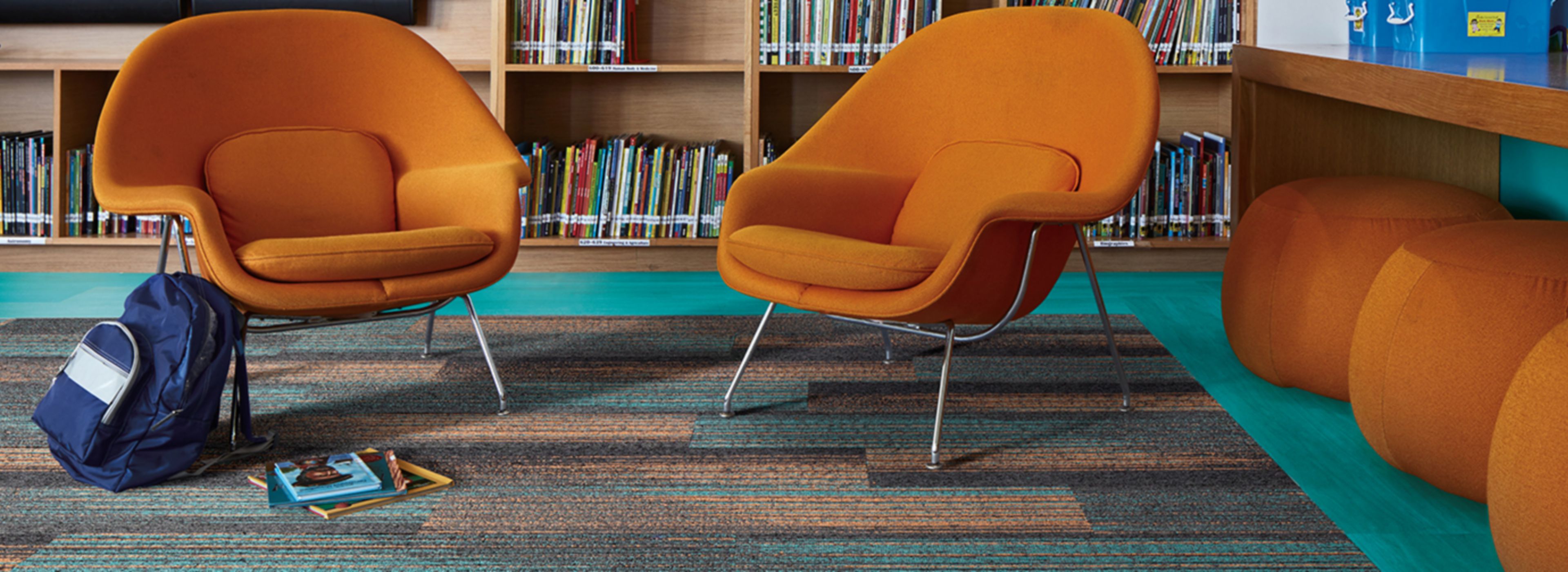 Interface Ground Waves Verse plank carpet tile and Studio Set LVT in library corner imagen número 1
